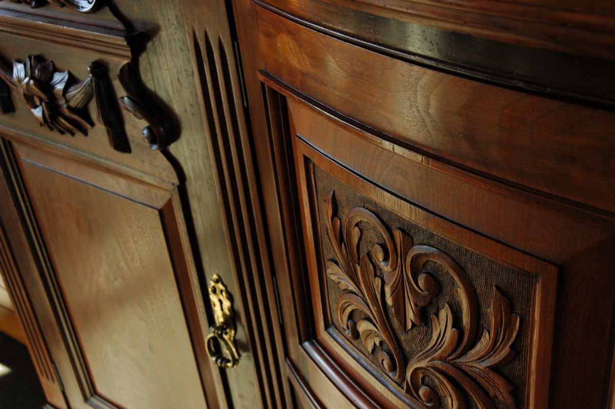 Polished carved wood ornate sideboard, dining room, Mill Rose Inn, Half Moon Bay, California, USA related to Antique Sideboards and Buffets: A Treasure Trove of Elegance and Functionality