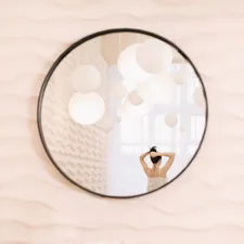 Portrait of calm pretty girl. Portrait of the woman reflected in mirror in a cozy light room in the morning. related to Elegant Mirror Images: 3 Captivating Mirrored Buffet Sideboard Designs
