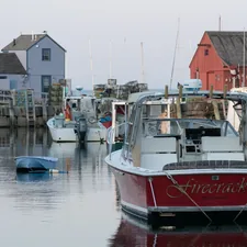 red and white boat related to Discover the Charm of Bed and Breakfasts in Rockport, MA