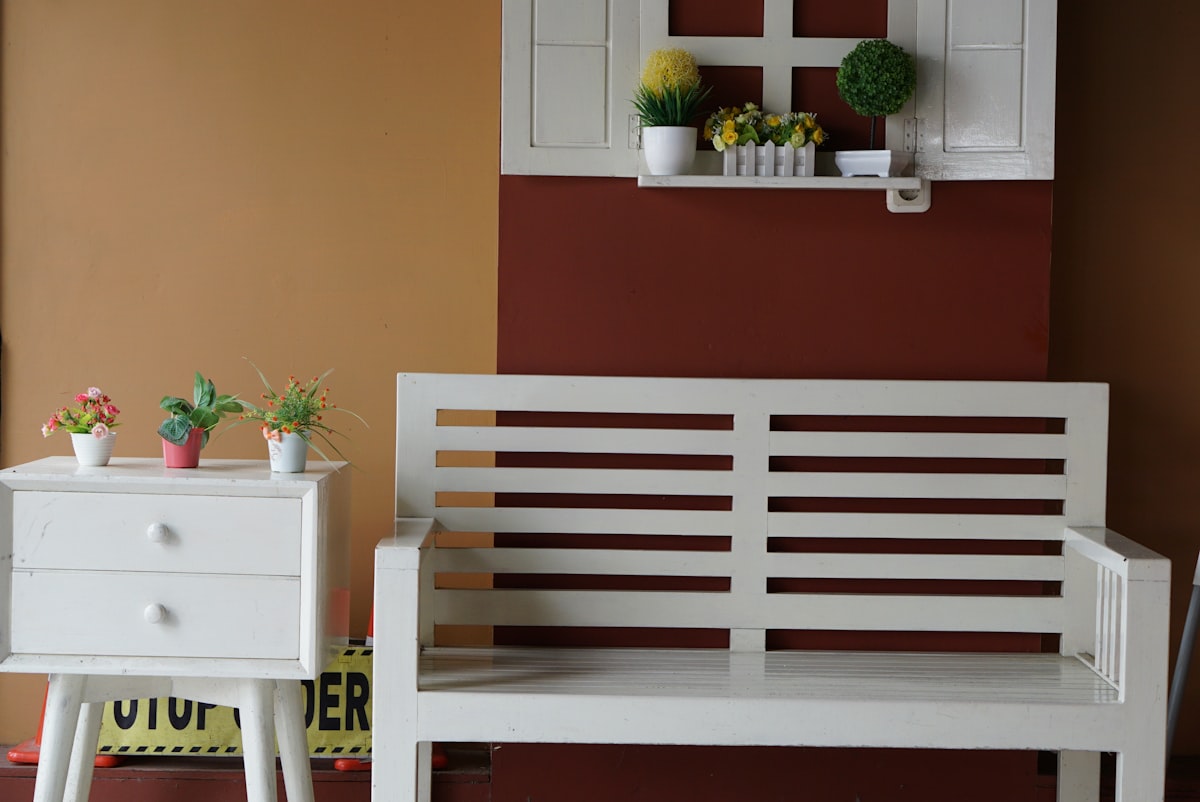 red and white wooden bench beside red and white flower on white wooden table related to Maximize Entryway Style with a Bench and Shelf Set