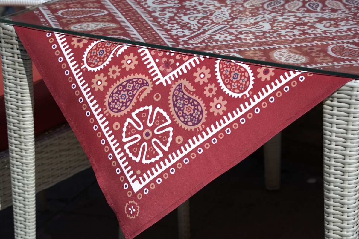 Red bandana pattern tablecloth on a table related to Red Paisley Valance: Add a Touch of Elegance to Your Home Decor