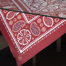 Red bandana pattern tablecloth on a table related to Red Paisley Valance: Add a Touch of Elegance to Your Home Decor