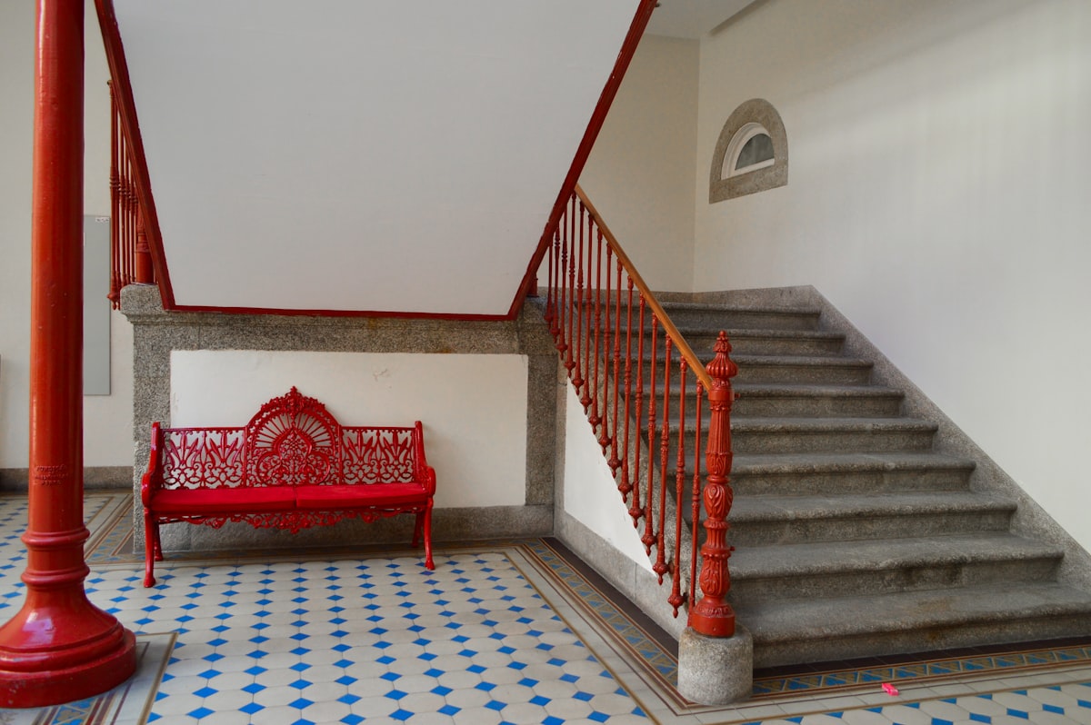 red steel bench near stair related to Red Entryway Bench