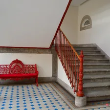 red steel bench near stair related to Red Entryway Bench