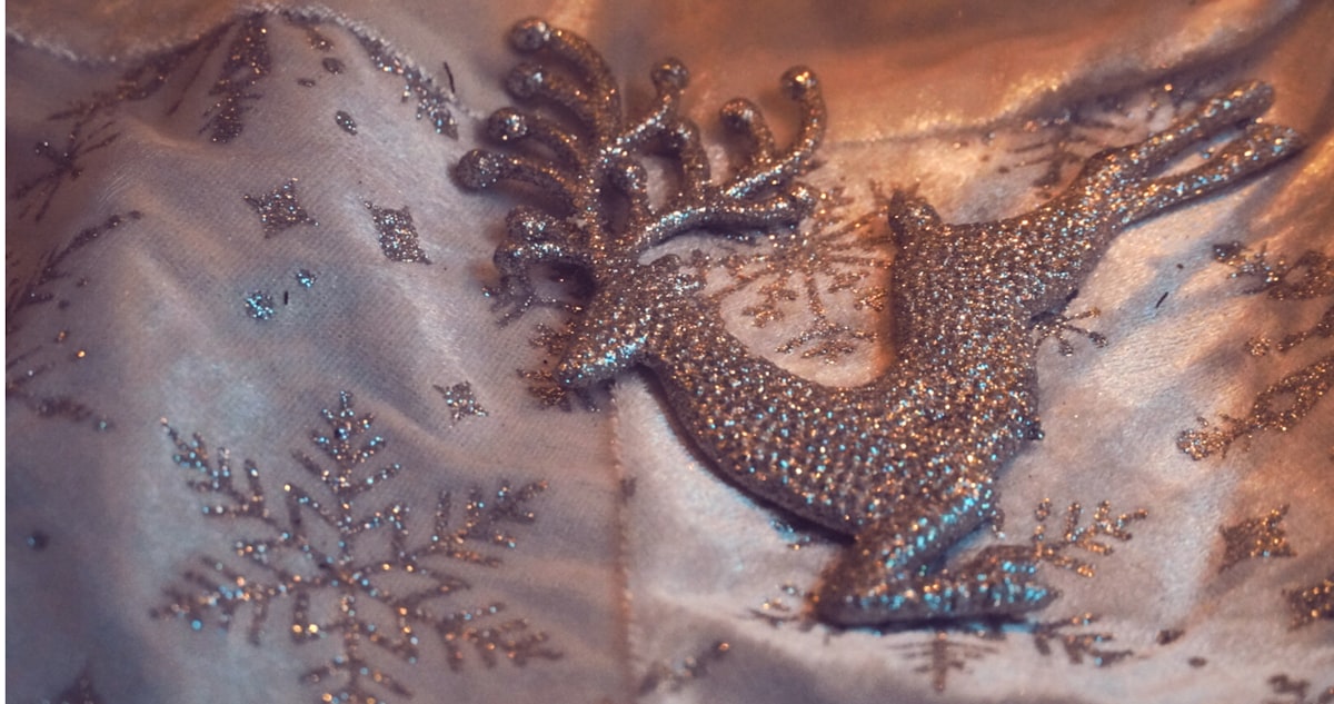 Reindeer on white material related to The Luxe Appeal of Silver and Gold Bedding: A Touch of Glamour for Your Bedroom