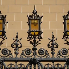 Reja de forja con faroles ámbar. related to Illuminating First Impressions: A Guide to Entryway Light Fixtures