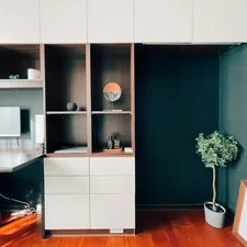 Room with a minimal interior. related to Creative Space-Saving Ideas with Two Beds in One