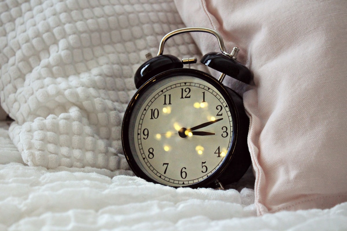 round black alarm clock displaying 3:12 related to Enchanting Bedtime Stories for Sweet Dreams