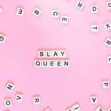 Scrabble pieces on pink surface related to A Comprehensive Guide to Queen Size Beds: How Big Are They Really?