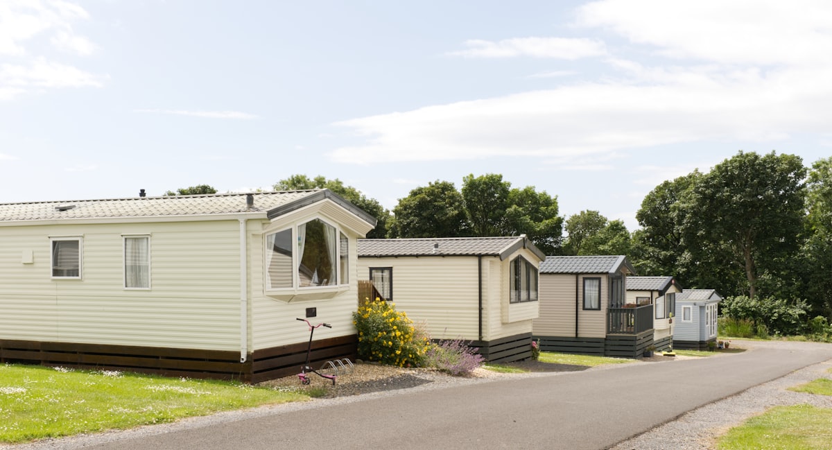 Several static caravans are parked along a road. related to Luxurious Comfort: Discovering Waterford Bedding Collections