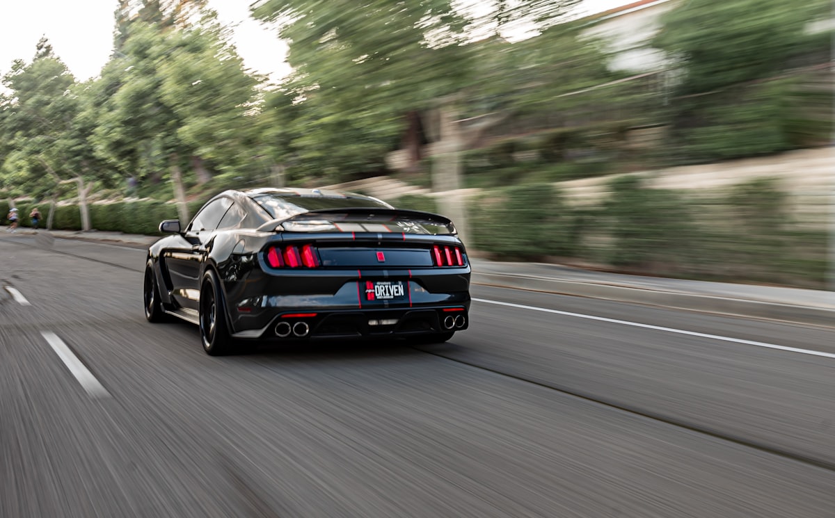 Shelby Mustang driving down the street. related to 2010 Mustang Rear Valance