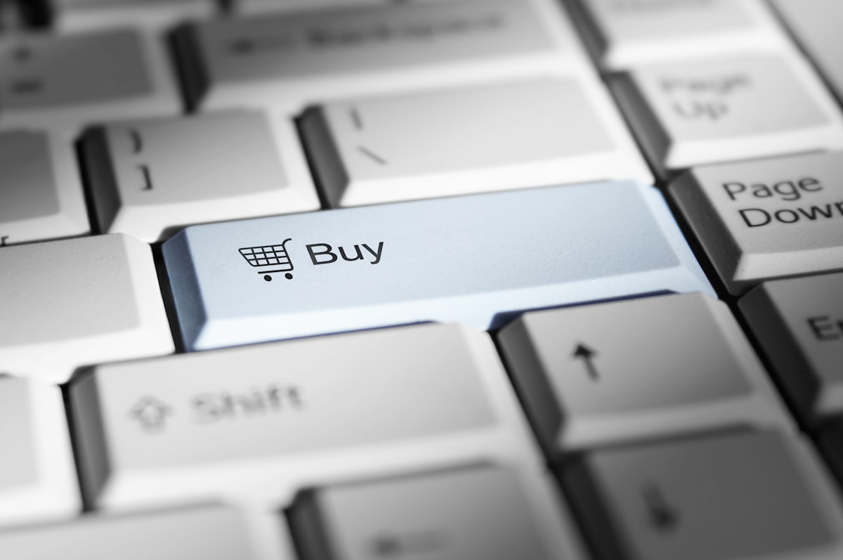 Shopping cart icon and the word "Buy" on a computer keyboard. related to Finding the Perfect Bed for Your Home