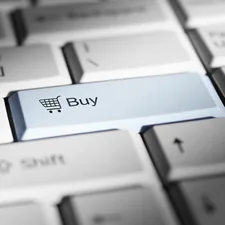 Shopping cart icon and the word "Buy" on a computer keyboard. related to Finding the Perfect Bed for Your Home
