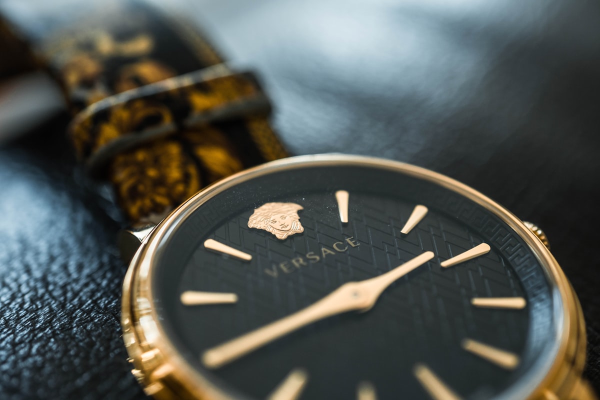 silver and gold chronograph watch related to Sleep Like Royalty: The Ultimate Guide to Versace Bed Sets