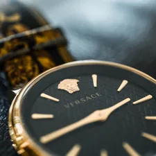 silver and gold chronograph watch related to Sleep Like Royalty: The Ultimate Guide to Versace Bed Sets