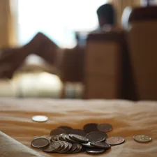 silver coins on brown wooden table related to Maximizing Savings: Unlocking the Best Bed Bath & Beyond 20 Coupon Deals