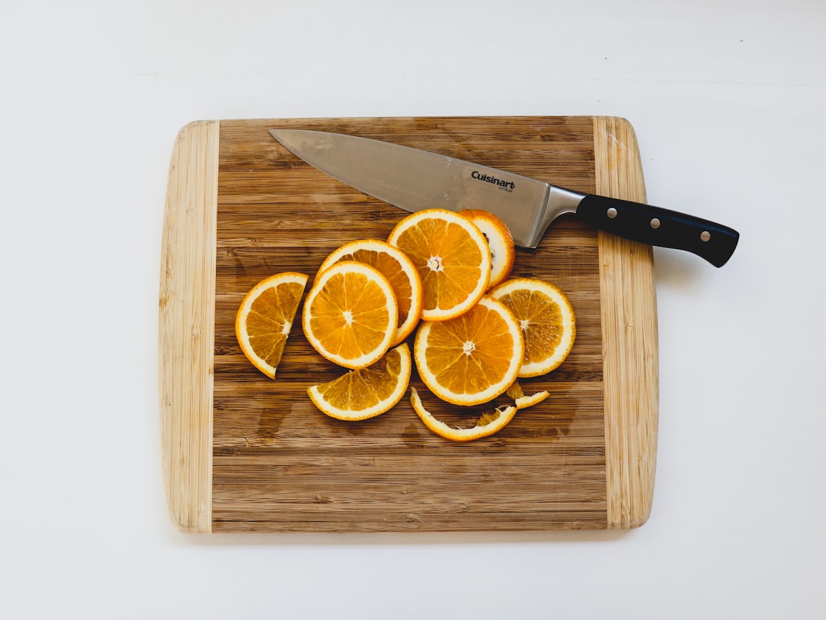 Sliced oranges on cutting board related to Brighten Up Your Kitchen with Orange Valances