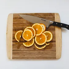 Sliced oranges on cutting board related to Brighten Up Your Kitchen with Orange Valances
