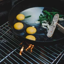sliced vegetables on black frying pan related to Cozy Up with the Green Egg Chiminea