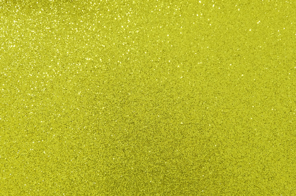 Sparkling Yellow Glitter Background related to The Vibrant World of Lime Green Bedding