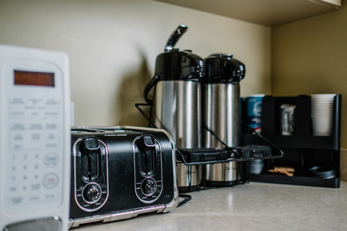 stainless steel bread toaster on brown wooden table related to Sizzling Deals: Navigating Bed Bath and Beyond Toasters
