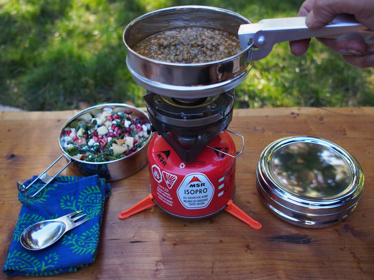 Stainless steel tiffin by ECOlunchbox is great for packing and heating food while camping or picnicking. related to Revolutionizing Outdoor Cooking: The Chiminea Pizza Oven
