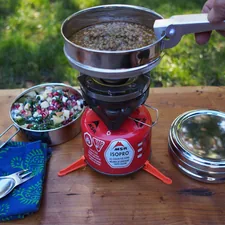 Stainless steel tiffin by ECOlunchbox is great for packing and heating food while camping or picnicking. related to Revolutionizing Outdoor Cooking: The Chiminea Pizza Oven