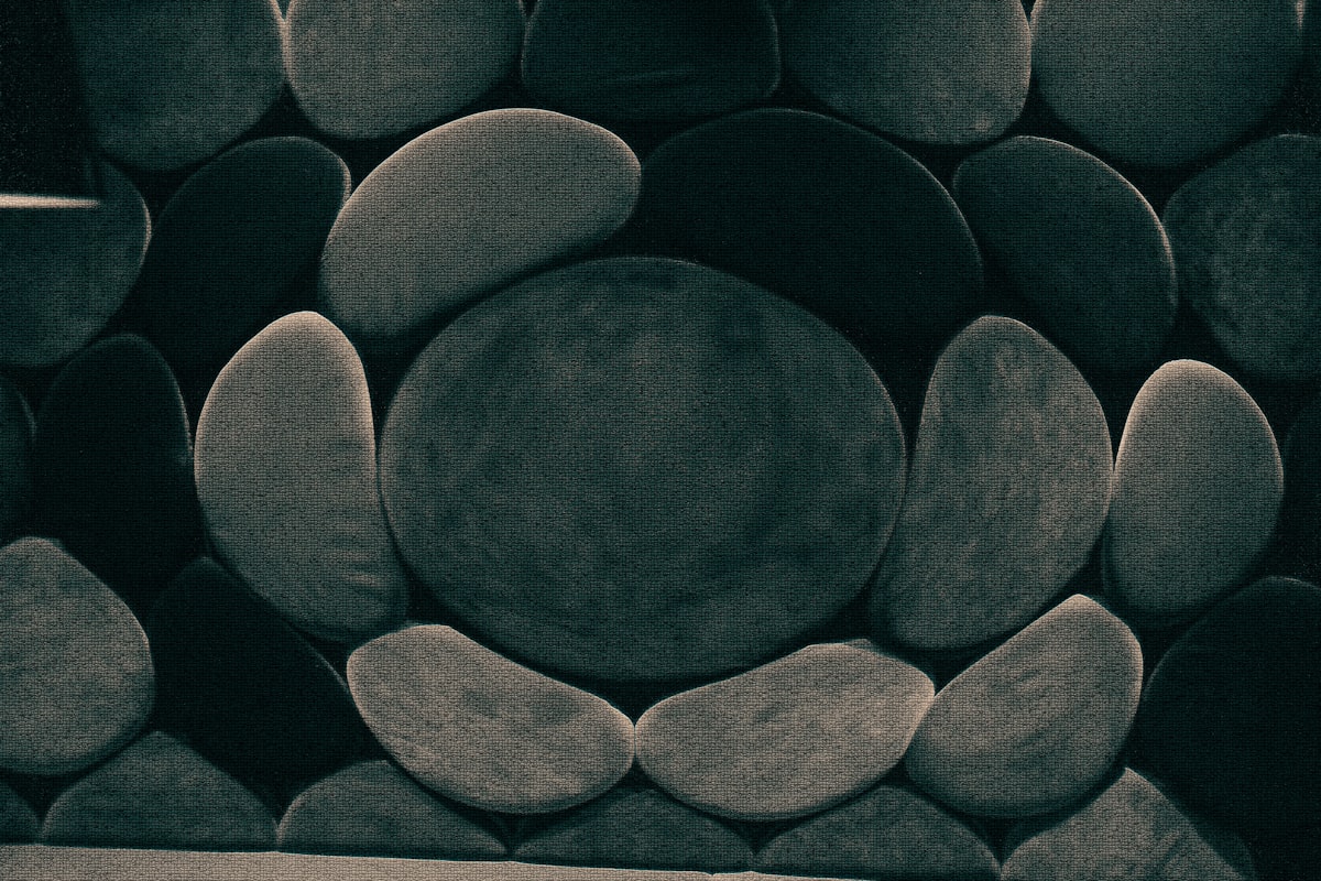 Stone-like cushions form a patterned wall. related to Round Bed for Sale: A Perfect Addition to Your Home
