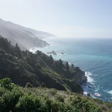 The California coast, draped in Pacific Ocean morning mist, along Highway 1 in Big Sur. related to Escape to Serenity: Discover the Best Big Sur Bed and Breakfasts
