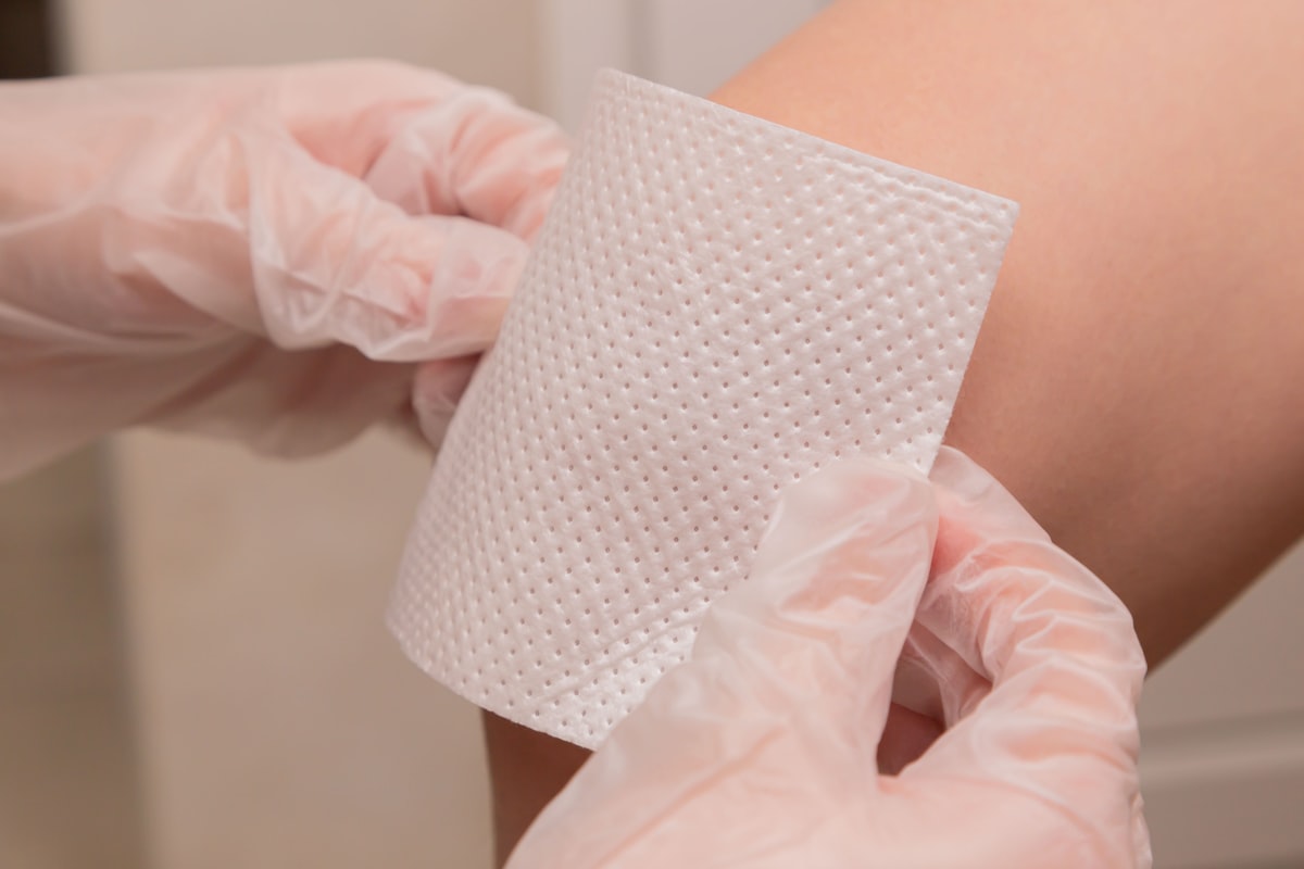 The doctor seals the wound to the patient. Vaccine. Wound. The medicine. Place for an inscription. Advertising. related to Coverlet Adhesive Dressing: Your Wound Care Solution
