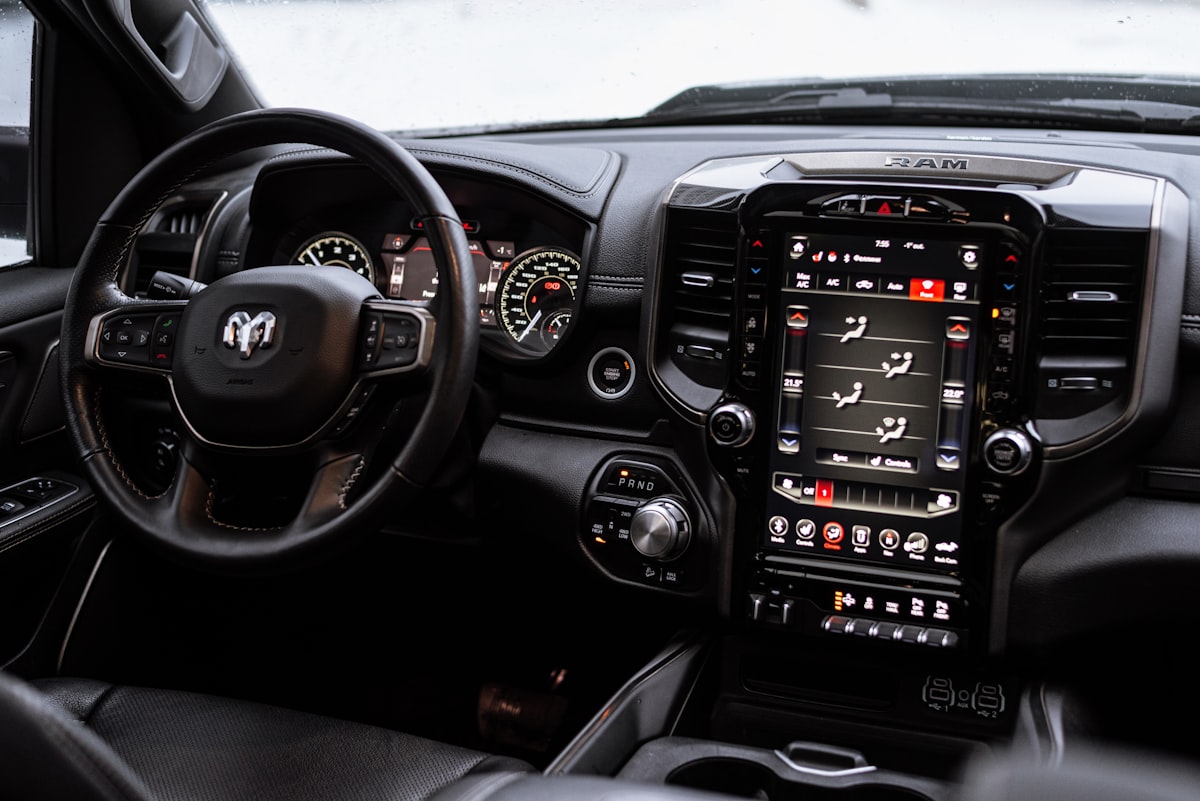 the interior of a vehicle with a steering wheel and dashboard related to Enhance Your Dodge Ram 1500: The Ultimate Guide to Bed Liners