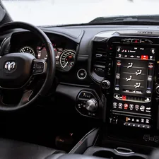 the interior of a vehicle with a steering wheel and dashboard related to Enhance Your Dodge Ram 1500: The Ultimate Guide to Bed Liners
