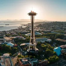 The Seattle Space Needle against Elliot Bay. Olympic National Park can be seen in the distance. 

This photo authorized via LAANC link to air traffic control, and operated under the FAA's Part 107 licensure. related to Transform Your Space with the West Elm Day Bed