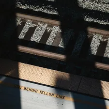 the shadow of a person standing on a train platform related to Yellow Gray Valance
