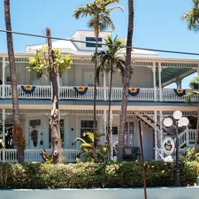 The Southernmost Point Guest House in Key West is an ocean view bed and breakfast in Key West, FL, located on the quiet end of world-renowned Duval Street. This house, with its elaborate Queen Anne style detailing, was built in 1894 by E. H. Gato, Sr. Soon after the house was built, Gato realized the rambling Victorian home was not getting the right sun exposure on his favorite porches, so he moved the house across the street. He had the huge structure rolled on logs pulled by mules. He also rotated the house to create the most favorable mix of sun and shade. related to Charming Stays in Paradise: Key West Bed and Breakfast