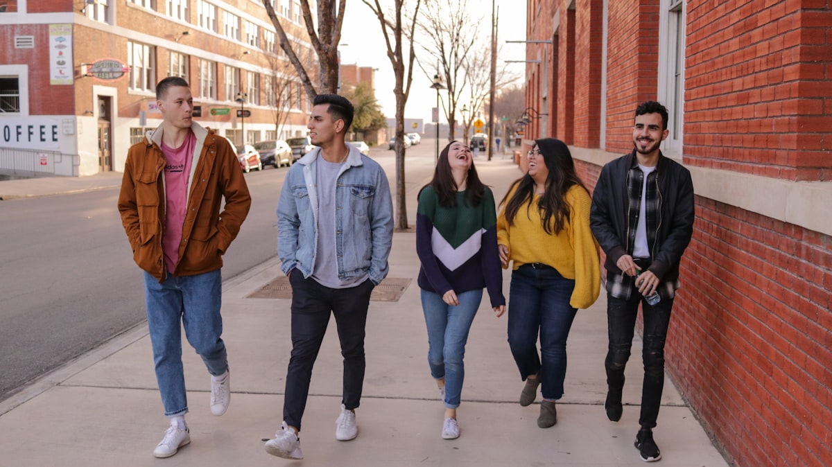 three men and laughing two women walking side by side related to Elevate Your College Experience with Stylish Macy's Dorm Bedding