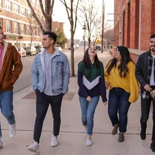 three men and laughing two women walking side by side related to Elevate Your College Experience with Stylish Macy's Dorm Bedding