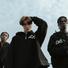 three men standing outdoors related to Off White Coverlets