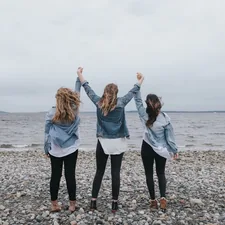 Three women on beach celebrating related to Dreamy Retreats: Tween Girls Bedding Ideas for a Cozy Oasis