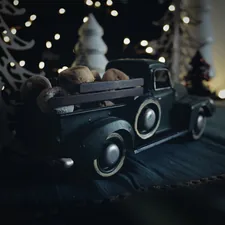 Toy truck full of mini donuts related to Rev Up Your Little One's Sleep with a Truck Toddler Bed