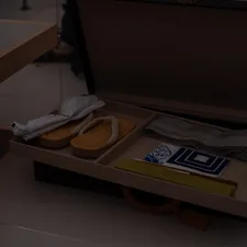Traditional japanese footwear and accessories in a wooden box. related to Stylish Shoe Storage Solutions: Shoe Trays for Your Entryway