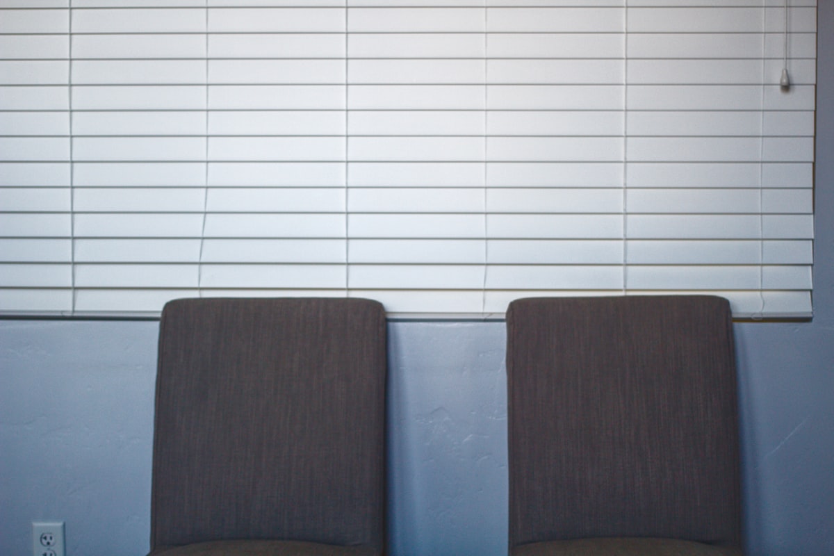 Two chairs in an office related to Wood Blind Valance Replacement