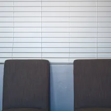 Two chairs in an office related to Wood Blind Valance Replacement