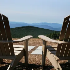 Two chairs overlook a mountain view. related to Snooze and Ski: A Guide to the Best Bed and Breakfasts in Killington, VT