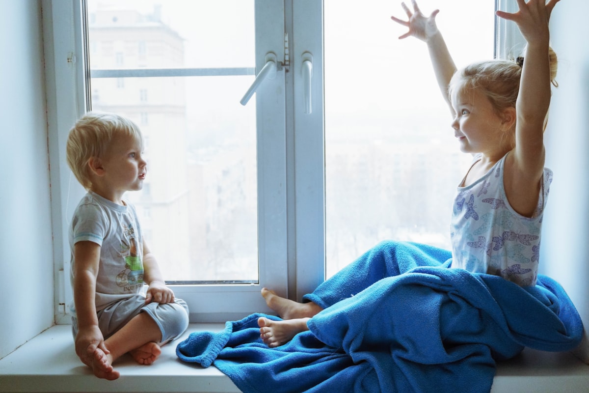 two children sitting near the window and communicate with each other related to Enhancing Your Child's Room with Mickey Mouse Clubhouse Valance