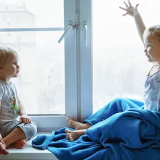 two children sitting near the window and communicate with each other related to Enhancing Your Child's Room with Mickey Mouse Clubhouse Valance