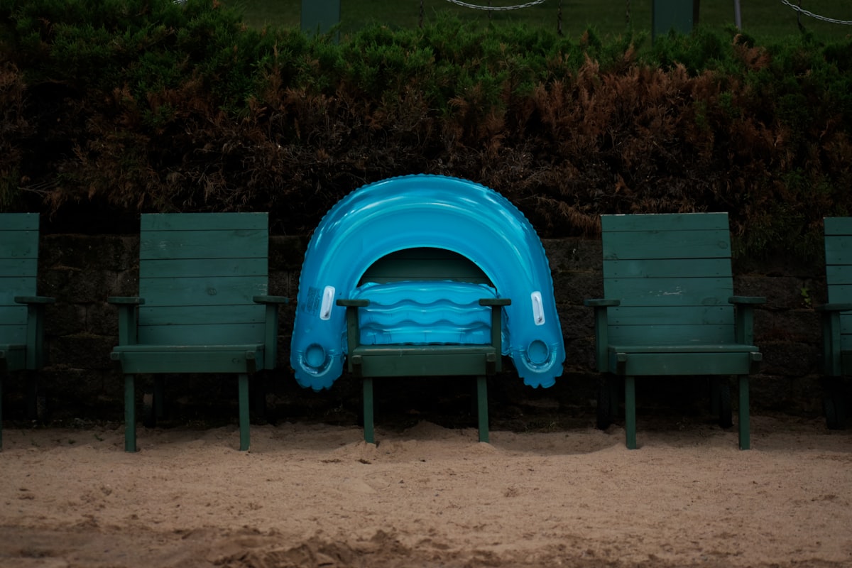 two green wooden armchairs related to The Ultimate Comfort Solution: Inflatable Couch Beds