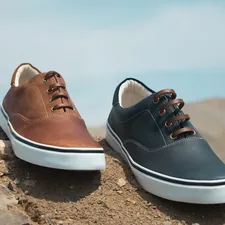 two unpaired brown and blue leather low-top sneakers related to Top Picks for Stylish and Durable Footwear