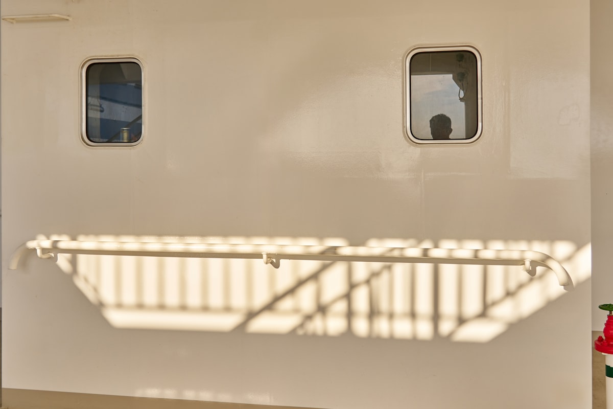 Two windows and a railing are shown on a wall. related to The Ultimate Guide to Choosing the Perfect Train Twin Bed