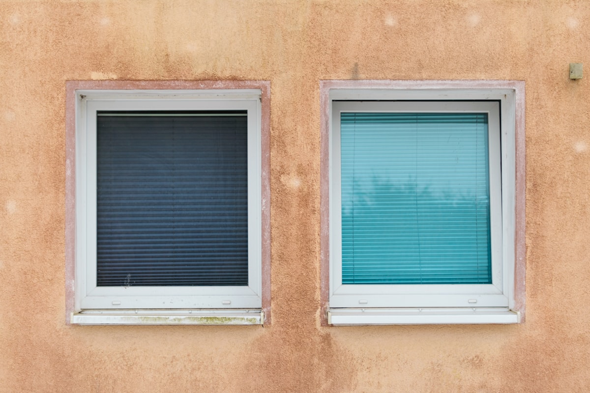 Two windows on a textured wall related to Elevate Your Windows with Unique Valances